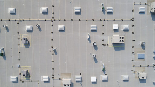 An overhead view of a flat commercial roofing system.