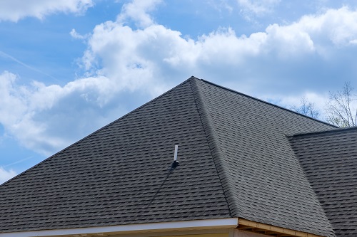 Roof covered with asphalt shingles roofing.